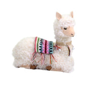 Lama assis blanc avec des cloches cm28x13h29