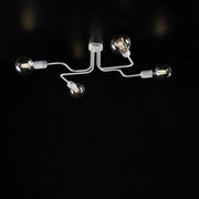 Plafonnier en fer laqué blanc à 4 lumières décor argent