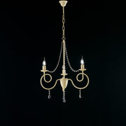 Lustre fer ivoire trois lumières décor décape et strass 50x h67 cm