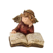 Ange en résine avec livre doré cm19x17h15,5