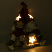 Résine LED Père Noël avec enfant rouge cm40x26h15