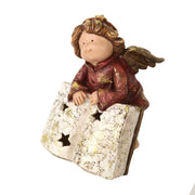 Ange en résine avec livre doré cm17x15,5h22,5