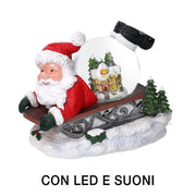 Père Noël traîneau résine led boule de verre avec musique cm19,5x12,5h18