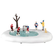 Figurines de filles jouant au hockey - Pour village de Noël