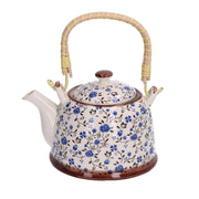 Théière ronde en céramique blanche avec fleurs bleues cmø15h14