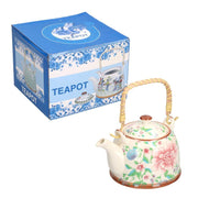Théière en céramique blanche avec fleurs cmø15h18